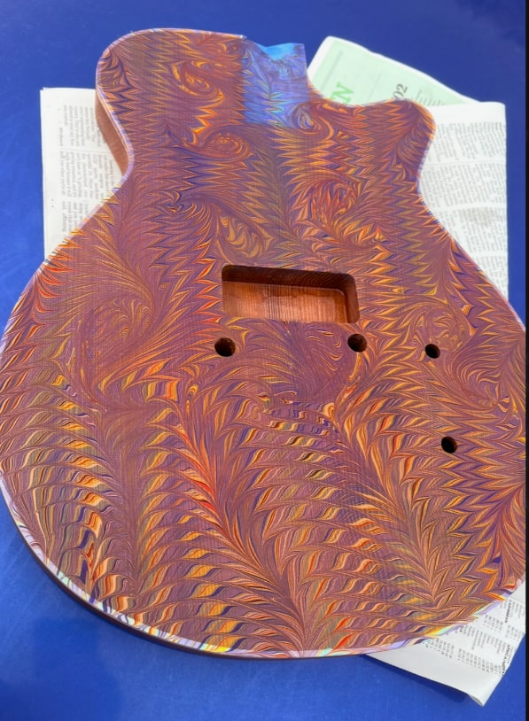 The first top on the tray, before the finish.